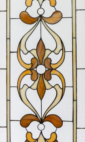 Traditional Pattern Stained Glass Window Design with brown and cream florals on white, bordered by clear glass.