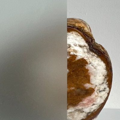 A polished geode is half-hidden behind frosted glass, with a Casa Loma Art Glass logo at the top right corner.