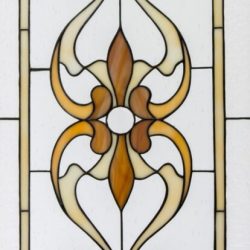 Vertical stained glass panel with symmetrical brown and cream floral patterns on a white background.